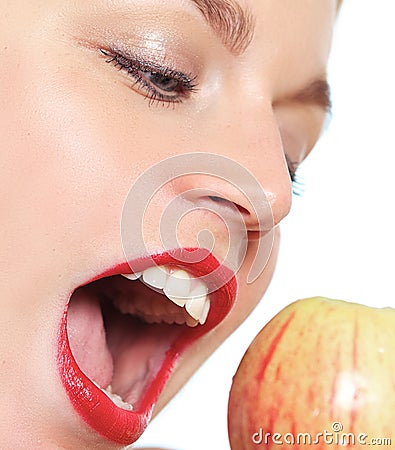 Female model biting an apple Stock Photo