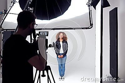 Female Model Working On Set In Photographic Or Film Studio Stock Photo