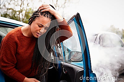 Female Motorist With Head Injury Getting Out Of Car After Crash Stock Photo