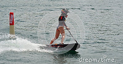 Female Motosurf Competitor moving at speed. Editorial Stock Photo