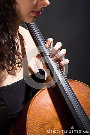 Female Musician Playing Violoncello Stock Photo