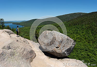 A female near Bubble Rock in Acadia National Park Stock Photo