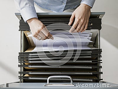 Office worker searching files in the archive Stock Photo