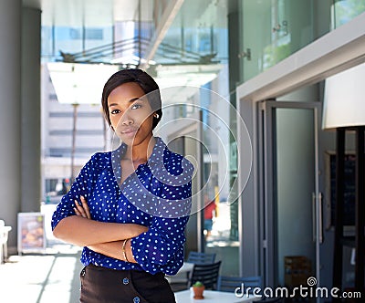 Female office worker standing outside business building Stock Photo