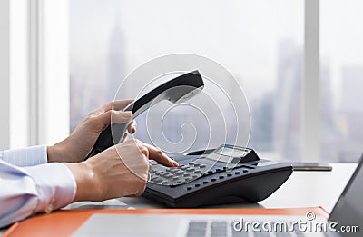 Female office worker making a phone call Stock Photo