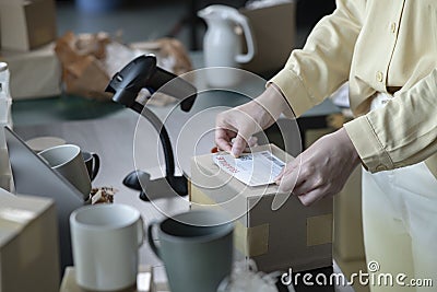 Female online store small business owner entrepreneur packing package post shipping box preparing delivery parcel on table. Stock Photo