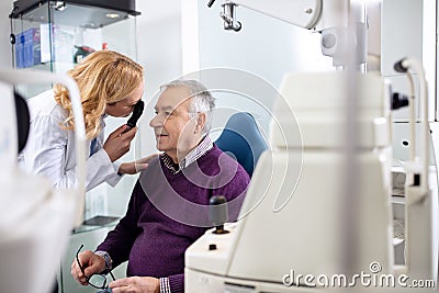 Female ophthalmologist determines diopter Stock Photo