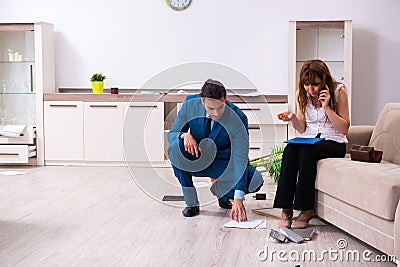 Female owner and male police officer in housebreaking concept Stock Photo