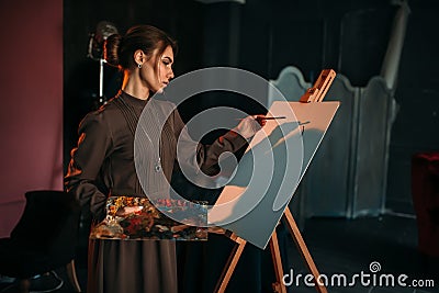 Female painter with brush and palette in hands Stock Photo