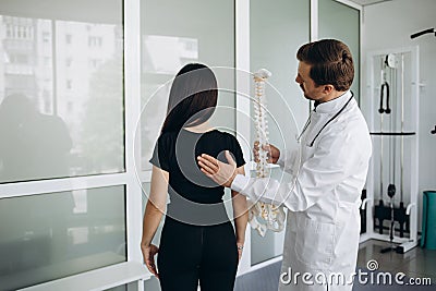 Female patient examining spine at physiotherapist at vertebrology center Stock Photo