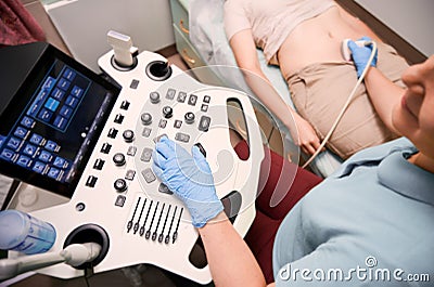 Female patient having ultrasound procedure in medical center. Stock Photo