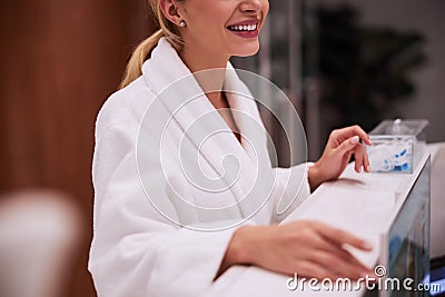 Female patient standing at a reception desk Stock Photo