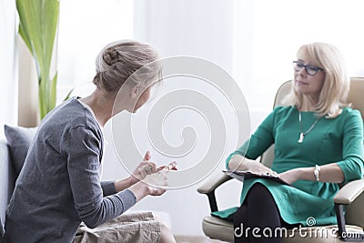 Female patient talking with therapist Stock Photo