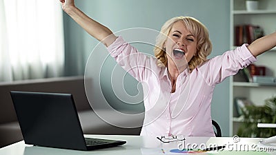 Female pensioner happy to win in creative idea competition, successful lady Stock Photo