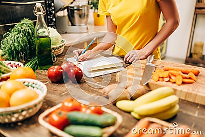 Female person cooking on the kitchen, bio food Stock Photo