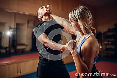 Female person on self-defense workout with trainer Stock Photo