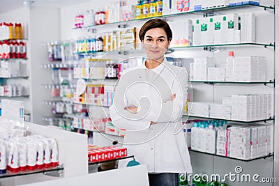 Female pharmacist arranging displayed assortment Stock Photo