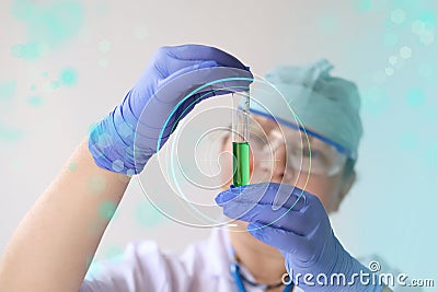 Female pharmacist, scientist holding a glass test tube with medicine, vaccine, modern science innovation concept, medical Stock Photo