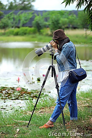 Female photograper shoot photo camera Editorial Stock Photo