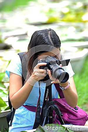 Female photograper shoot photo camera Editorial Stock Photo