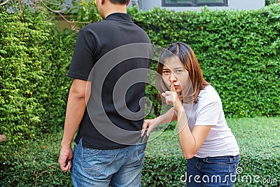 Female pickpocket stealing a wallet from behind pocket on jeans Stock Photo