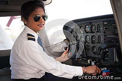 Female Pilot in the Cockpit Stock Photo