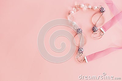 Female pink beads on pink background. Empty space for text Stock Photo