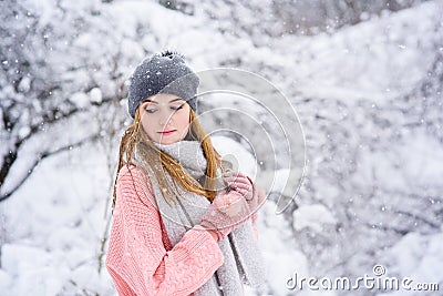 Portrait of young blondy girl during snowfall Stock Photo