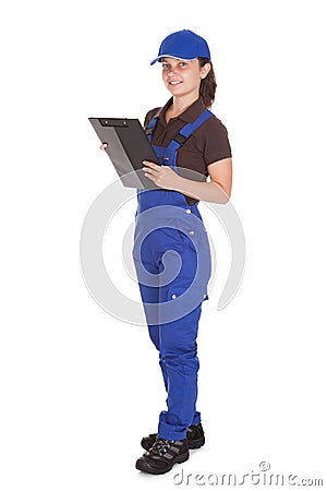 Female plumber holding clipboard Stock Photo
