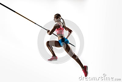 Female pole vaulter training on white studio background Stock Photo