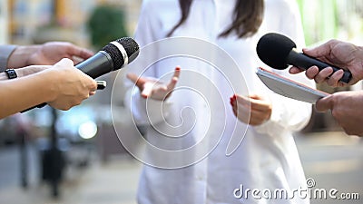 Female politician talking on media press conference, public relations, event Stock Photo