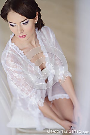 Female portrait of cute lady in white bra indoors Stock Photo