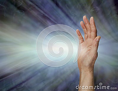 Female Pranic healer sending focused energy from right hand palm chakra Stock Photo