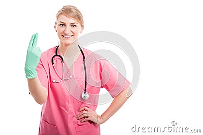 Female proctologist posing showing fingers and smiling Stock Photo