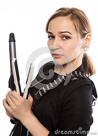 Female professional hairdresser with ploy. Elegant woman presents her hairdresser`s accessories. Hair styling and beauty concept Stock Photo