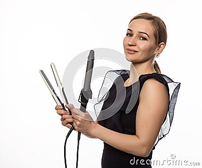 Female professional hairdresser with ploy. Elegant woman presents her hairdresser`s accessories. Hair styling and beauty Stock Photo