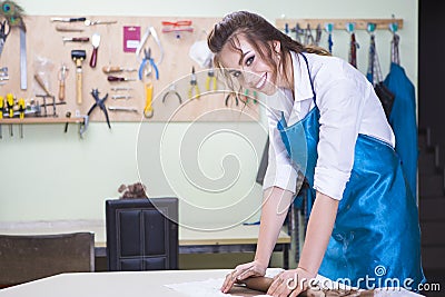 Female Professional During a Process of Clay Preparation on Table in Workshop Stock Photo