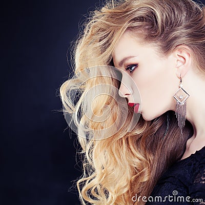 Female Profile. Beautiful Woman with Long Wavy Blonde Hair Stock Photo