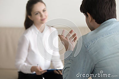 Female psychologist consulting male patient, job interview, busi Stock Photo