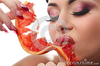 Female with pummelo slice Stock Photo