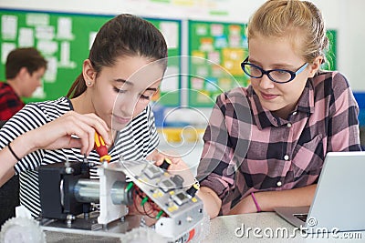 Female Pupils In Science Lesson Studying Robotics Stock Photo