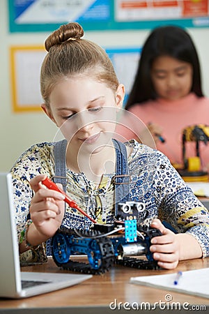 Female Pupils In Science Lesson Studying Robotics Stock Photo