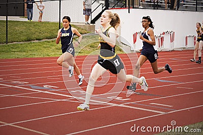Female Runners at High School Track Meet Editorial Stock Photo