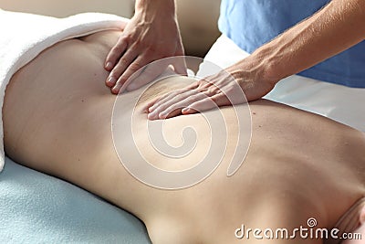 Female receiving back massage Stock Photo