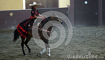 Female rider in black and red dress Editorial Stock Photo