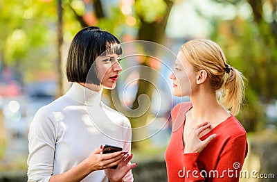 Female rivalry. Friendship problems rivalry and jealousy. Pretty girls friends sisters. Eye contact. Women looking at Stock Photo