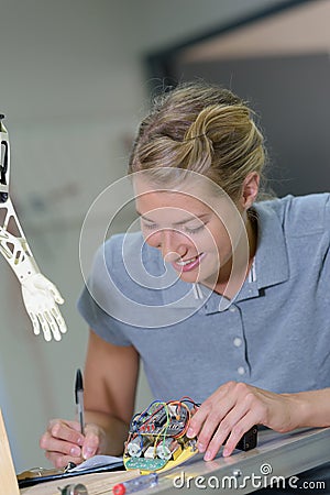 Female robotic electrician smiling Stock Photo