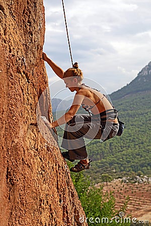 Female rock climber Stock Photo