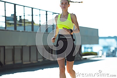 Female runner, athlete training outdoors in summer`s sunny day. Stock Photo