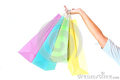 Female's hand holding colorful shopping bags Stock Photo